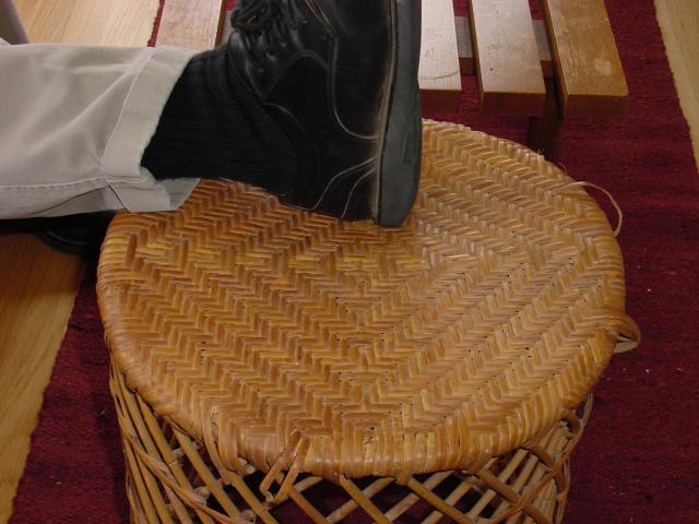 A woven footstool