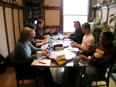 [photo of players in John's dining room]